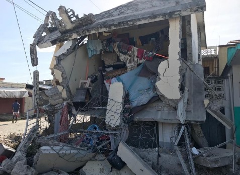 A person's belongings are seen hanging from a badly damaged building, following the earthquake in Haiti on 14th August 2021