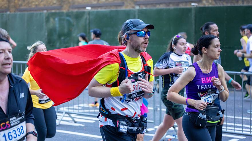 The smiling face of a British Red Cross participant running in the London Landmarks half marathon. 